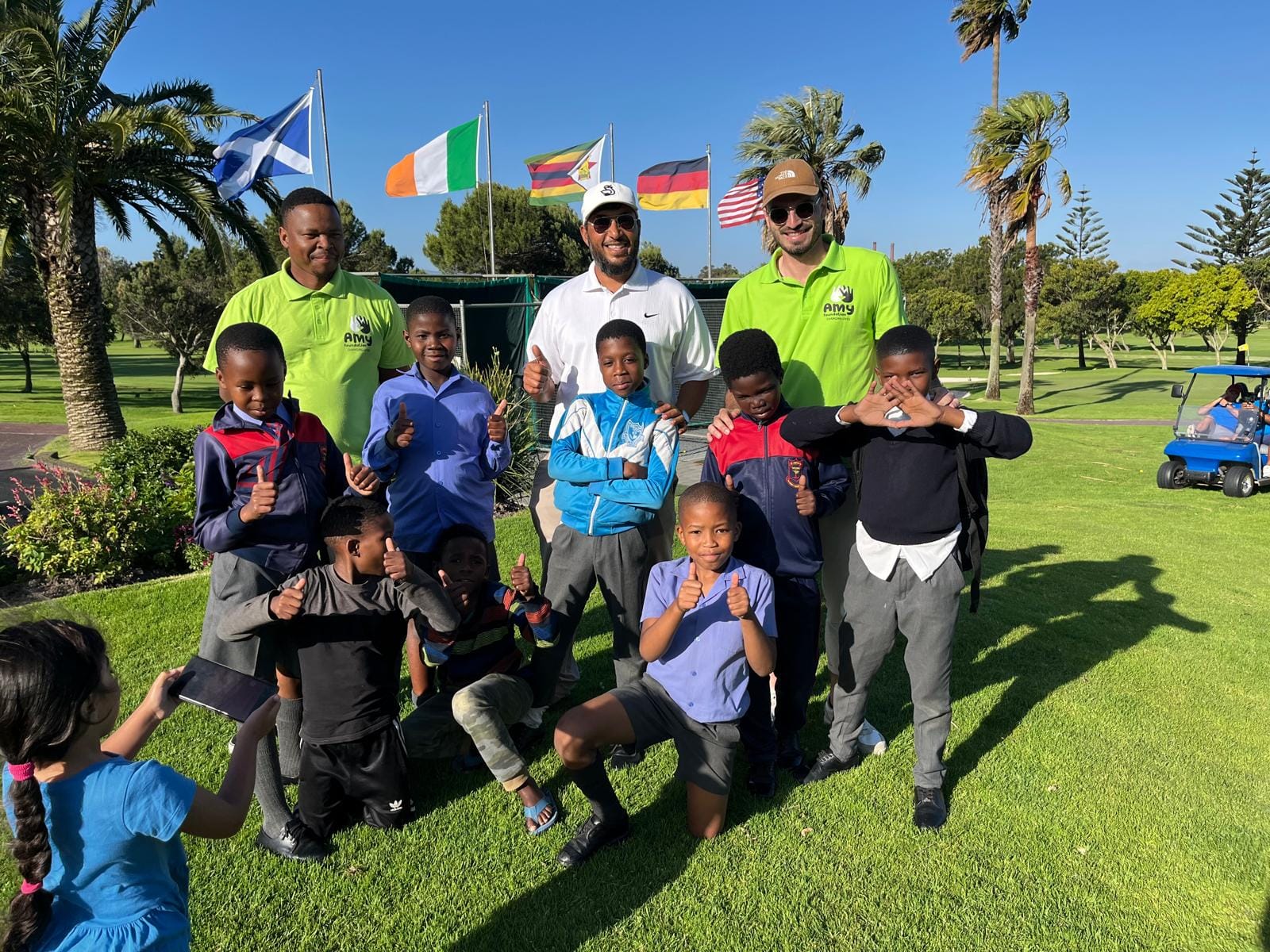 Muhammad with junior golfers from the Amy Foundation