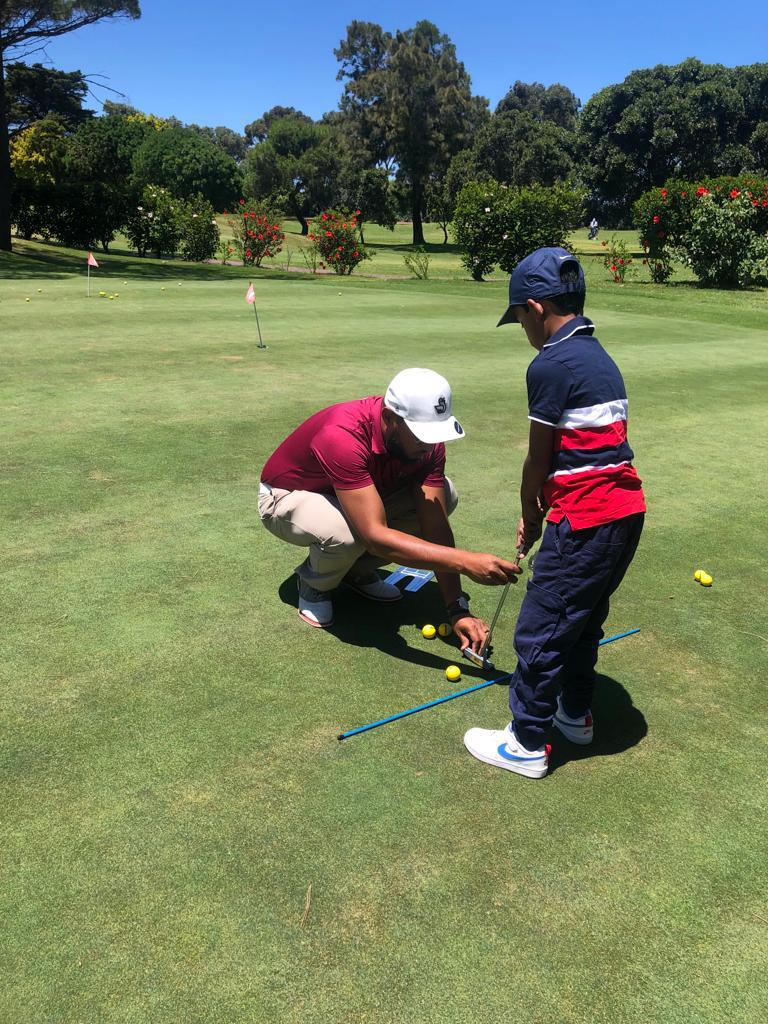 Coaching a junior on putting alignment